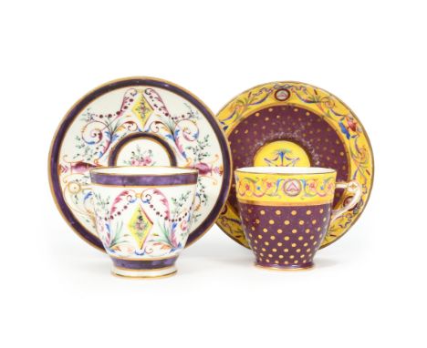 Two Sèvres cups and saucers (tasses etrusque et soucoupes)  c.1794-99, one painted with berried leaf sprays and foliate scrol