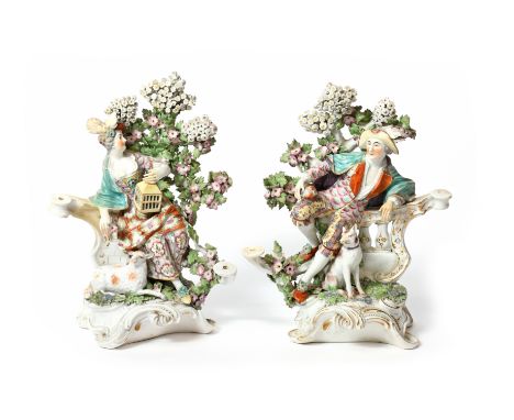 A pair of Derby candlestick groups of Matrimony and Liberty  c.1770, of a shepherd and shepherdess seated before flowering bo