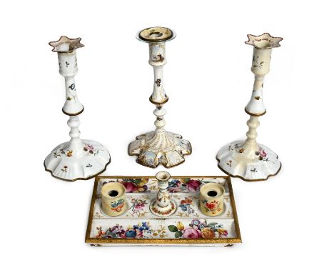 A pair of Staffordshire enamel candlesticks 2nd half 18th century, the knopped shapes sparsely painted with polychrome flower