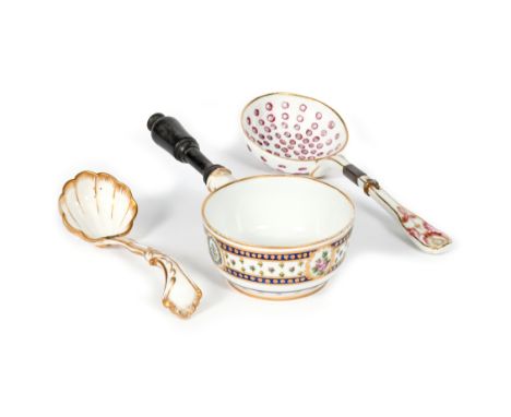 A Sèvres small saucepan or warming pot c.1780-90, the circular body painted with panels of pink roses and cornflower reserved