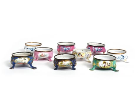 Nine English enamel tripod salts late 18th century, including three pairs, the circular bodies variously decorated with flowe