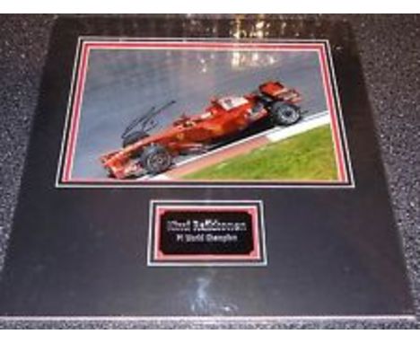 Raikkonen Kimi A 39cm x 39cm double 3D display in acid free mount board with engraved metal plaque, mounted with a genuine si