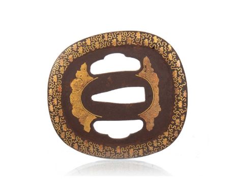 JAPANESE IRON AND GILT DECORATED TSUBA, MEIJI PERIOD with floral detail to border7cm longThere is surface oxidisation, some s