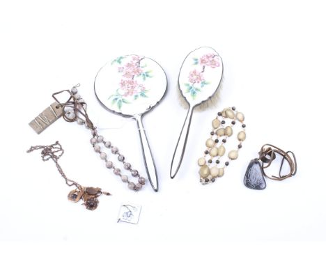 A silver and floral guilloche enamelled hand mirror and hair brush and a small collection of costume jewellery. The brush and