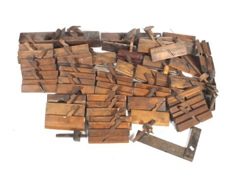 A collection of assorted vintage carpenter's wooden tools. Including moulding planes, jack planes, etc. 