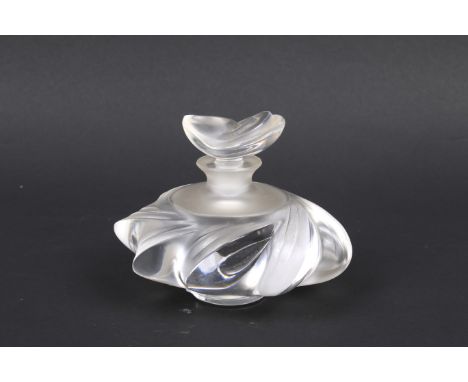 A Lalique Samoa France perfume bottle 'ocean wave and shell' design. H8cm Condition Report: Appears in an excellant condition