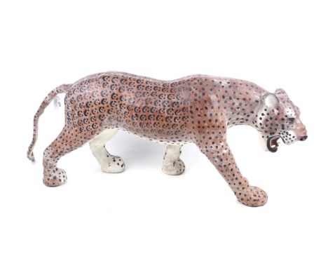 A large papier mache model of a leopard. Realistically modelled standing and snarling, approx. 32cm high, 93cm nose to tail