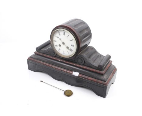 A Victorian black slate striking mantel clock. Eight day movement striking to a bell, white enamel dial with Roman numerals, 