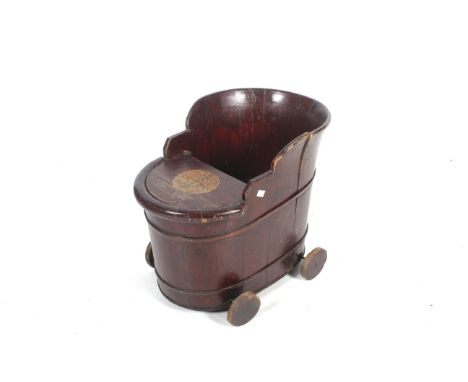 A vintage Chinese coopered barrel type children's trolley seat. On four wooden wheels with removable shelf/tray. L60cm x D40c