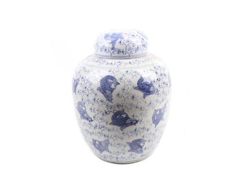 A large Chinese blue and white ceramic ginger jar. Decorated with fish. H38cm