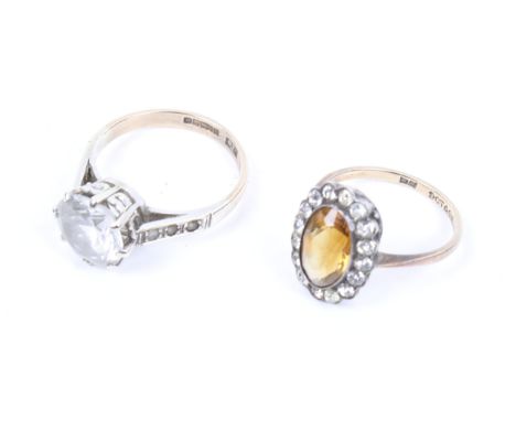 A 9ct gold and round-faceted paste single stone ring and a citrine ring. The first with hallmarks for Birmingham 1994, size N