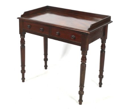 A Victorian mahogany writing desk. Having two drawers with turned handles, raised on turned tapering supports. H80cm x W88cm 