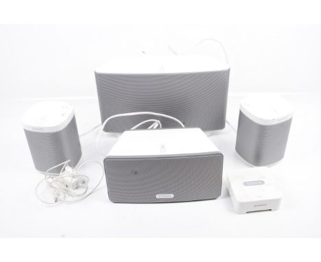 A set of Sonos Play:3 smart wireless speaker system. S/n: 1401 00-0E-58-6C-17-F8-8, consisting of four speakers and an ethern