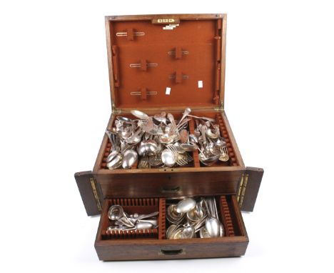 A vintage Fitzall oak two drawers canteen of mixed silver plate cutlery. Of mostly spoons and forks. L45cm x D36cm x H23cm