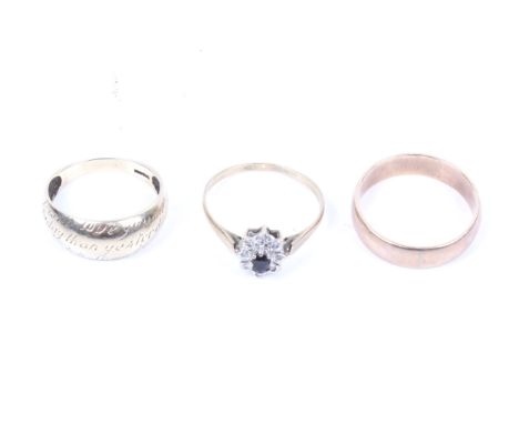 Three gold rings including an early 20th century rose gold broad band ring.  Unmarked, 5.2mm wide, size leading edge R+, 3.7g