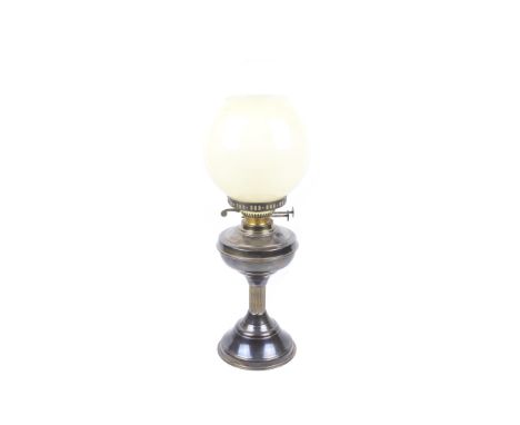 A 20th century brass oil lamp. Having a cream glass shade and glass funnel. H31cm Condition Report: Appears in excellant cond