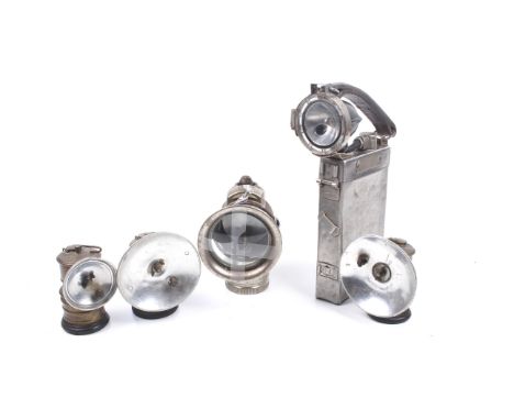 A group of five assorted vintage lamps. Including four carbide bicycle lamps (1x Miller 4A) and a Nife Type miners lamp no. N