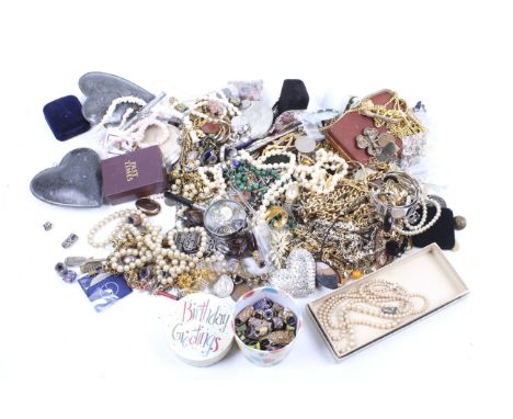 An assortment of costume jewellery. Including glass beads, gold plated chains, a string of imitation pearls, a small selectio
