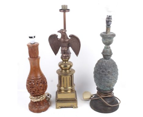 Three contemporary lamps including a bronze patinated 'pineapple' lamp. A brass-effect spelter 'eagle lamp' and a far eastern