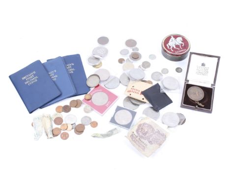 A collection of commemorative coins and currency. Mostly 20th century, including three sets of Britain's first decimal coins