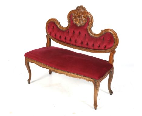 A rococo style carved mahogany frame button back settee / sofa. Having red upholstered fabric button back seat with cabriole 