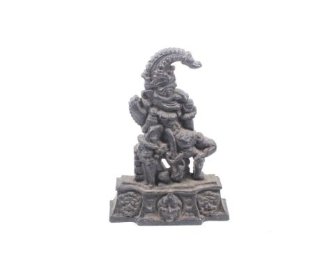 A vintage cast metal 'Mr Punch and Toby' door stop. Marker mark 'Fisher Foundries'. H33cm