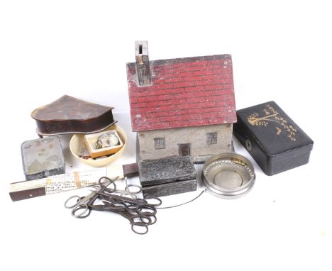 A collection of objects. Including a tortoiseshell veneered grand piano shaped trinket box. A scratch built 'folk art' cottag