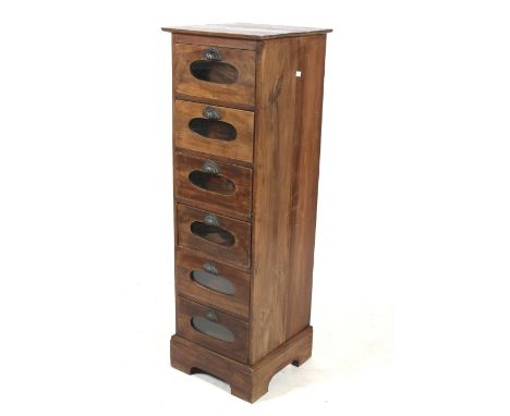 A vintage haberdashery or shop keeper's cabinet. Having six glass fronted drawers with metal handles, raised on bracket suppo