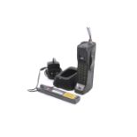 Vintage / Retro mobile phone - Motorola 8500. Together with a desk charger and spare battery.