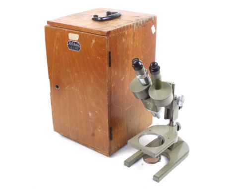 A vintage MEOPTA Czech, binocular microscope. Model 215959, in a fitted wooden case with a handle to the top, marked 'D. R. G