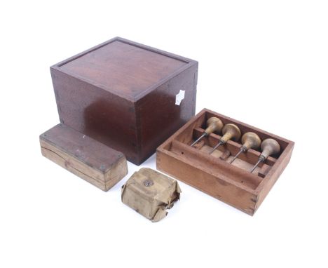 A vintage mahogany wood engraving tools box and contents. Having a sliding cover opening to reveal a fitted tray and lower co