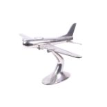 Chrome desk model of WWII B17 Flying Fortress aeroplane. Made in solid aluminium, raised on a stand.