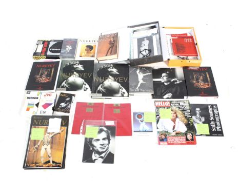A collection of Rudolf Nureyev and ballet ephemera. Including printed photographs and newspaper clippings, videos of his perf