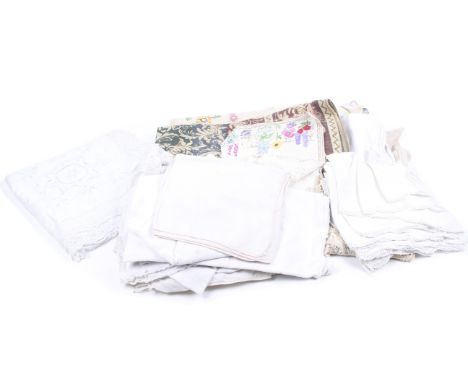 An assortment of vintage fabric. Including linens, tablecloths, napkins, lacework and more