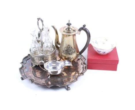 A collection of silver plated items. Including a shaped-round salver, a four bottle round cruet stand, a sauce boat and a bra