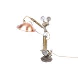 A scratch built 'Steam Punk' table lamp. Twin gauges above brass taps with a copper shade.