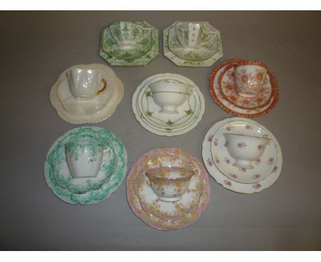 EIGHT WILEMAN 'THE FOLEY CHINA' TRIOS, to include 'Spano-Lustra' iridescent glaze, two Antique shape Art Nouveau pattern No.7