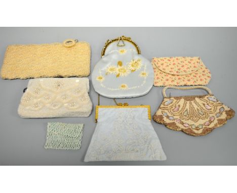 A COLLECTION OF VINTAGE HANDBAGS, to include four beaded clutch bags, together with two handbags with chain handles, one with