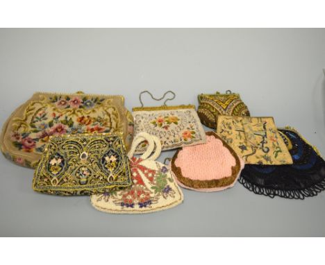 A COLLECTION OF HANDBAGS, to include a tapestry bag and three hand embroidered handbags two with enamel decorative clasps (8)