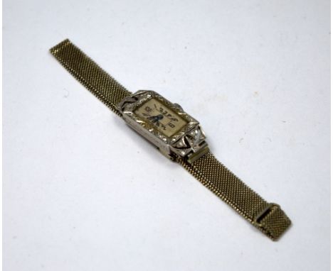 A LADIES DIAMOND ART DECO COCKTAIL WATCH, with rectangular shape face within a surround of old mine-cut diamonds to the chain