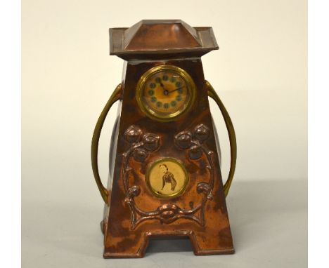 AN ART NOUVEAU COPPER ARCHITECTURAL MANTEL CLOCK, with oversailing top, fruit and leaf embossed decoration and portrait minia