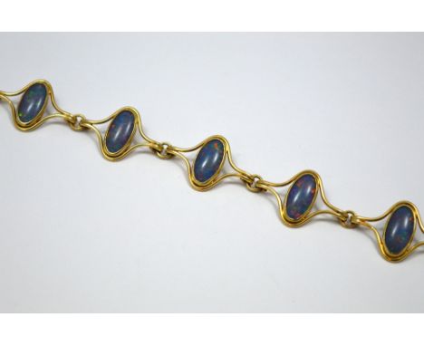 A 9CT GOLD OPAL BRACELET, comprising of five oval shape opals within an abstract setting for each, length 19cm, hallmarks for