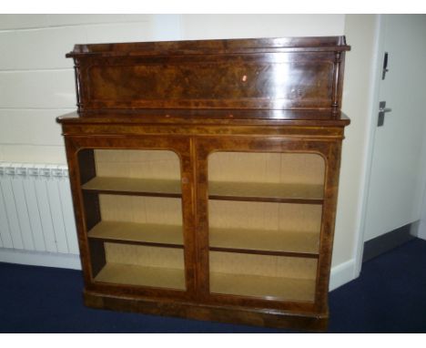 A 19TH CENTURY WALNUT GLAZED TWO DOOR BOOKCASE/DISPLAY CABINET, the raised back with shelf supported on twin turned columns, 