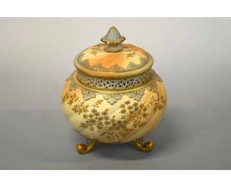 A ROYAL WORCESTER BLUSH IVORY POT POURRI JAR AND COVER, of bulbous form with ribbed body on scroll tri form supports with app