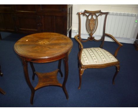 A CIRCULAR ROSEWOOD OCCASIONAL TABLE, with string and musical instrument central inlay on shaped extending legs with stretche