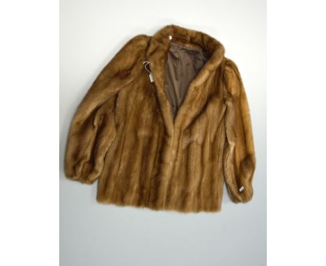 A FUR COAT, with no collar of light brown fur, label for Edelson & Personal stitching of letters, 'D.H', size 10-12
