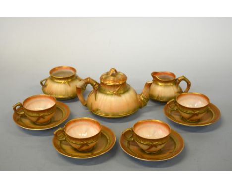 A ROYAL WORCESTER TEA SERVICE, in bamboo design with gilded blush ground, comprising four cups, four saucers, sugar bowl, mil