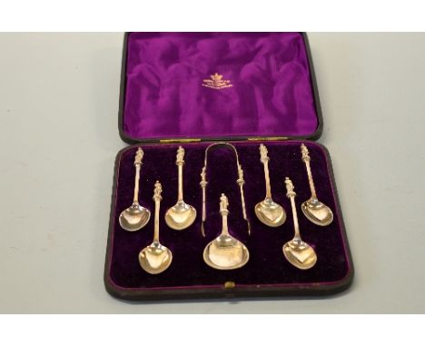 A CASED SET OF SIX SILVER APOSTLE SPOONS, SUGAR BOWL AND CADDY SPOON, London 1878, marks rubbed, Charles Eley