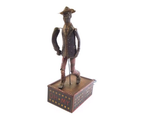 A Lehmann No 690 'Oh My'  tinplate clock work dancing figure:, the figure with straw hat, blue jacket and red checked trouser