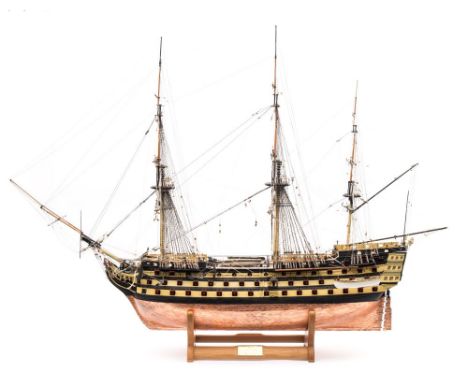 A scale model of HMS Victory: standing and running rigged over detailed decks, open gun ports with guns and copper clad hull,